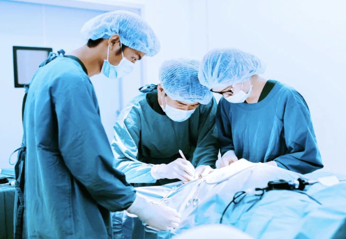 Surgeons performing a hip replacement